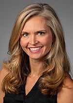 An image of Dr. Karen Litwa. She has tanned skin, blonde hair, and is smiling.