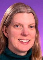 A close-up image of Dr. Katrina DuBose. She has pale skin, long blonde hair, and is smiling. The picture was taken in front of a purple background.